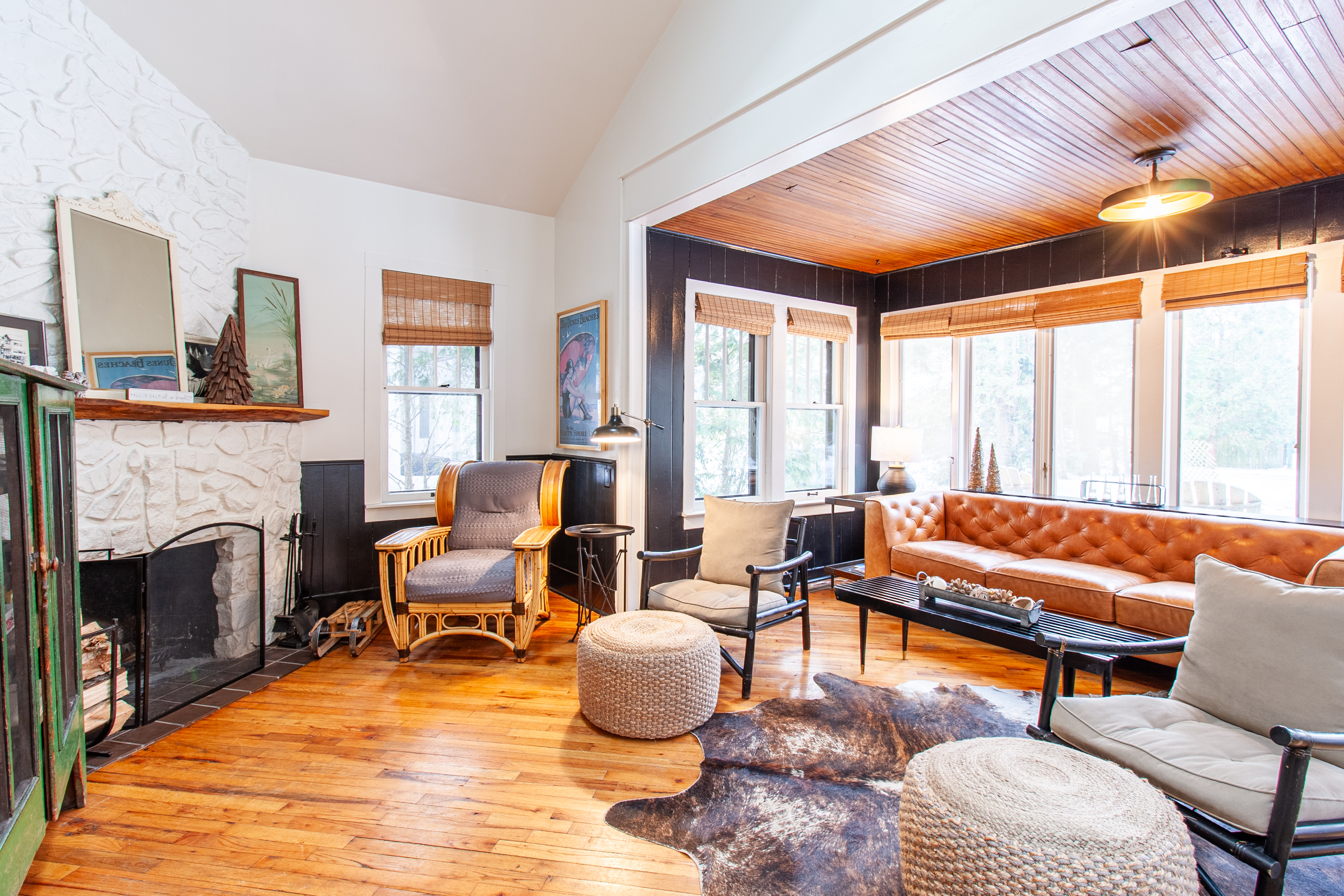 Living room armchairs facing the stone fireplace