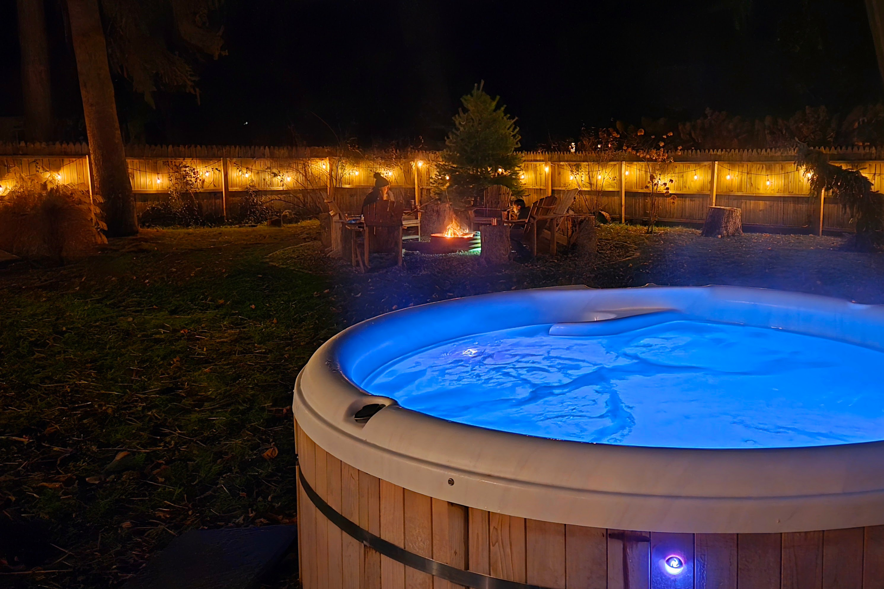 Hot tub lit up at night